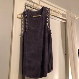 Distressed purple tank top with crosses on side.